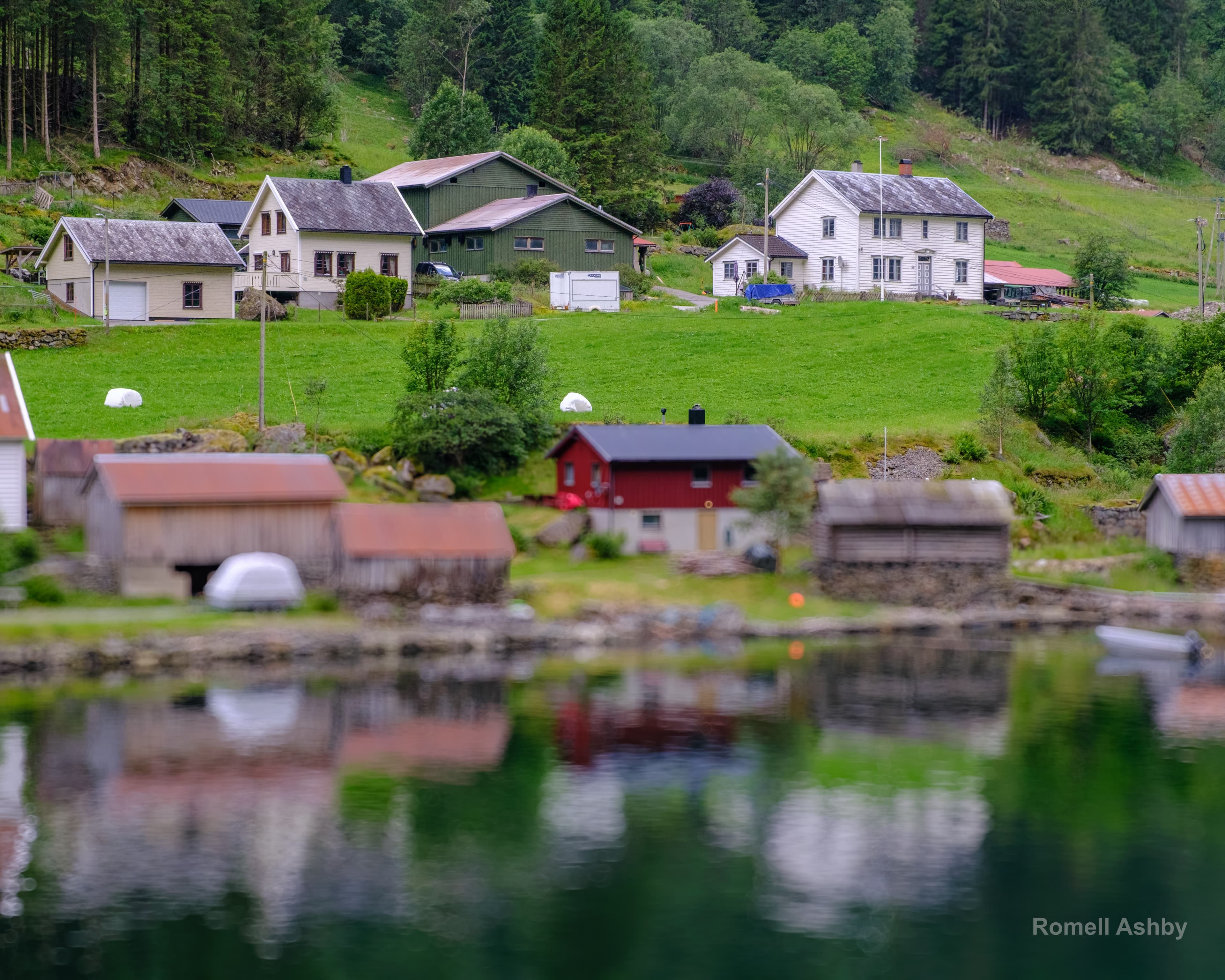 Norwegian mountain landscape above a calm fjord